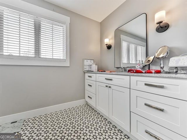 bathroom featuring vanity and baseboards