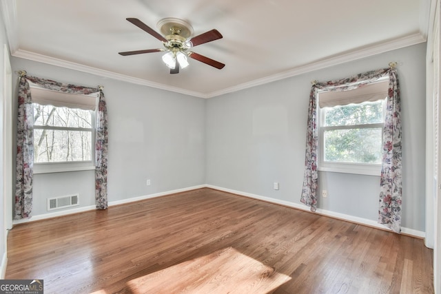 spare room featuring ceiling fan, crown molding, and hardwood / wood-style floors