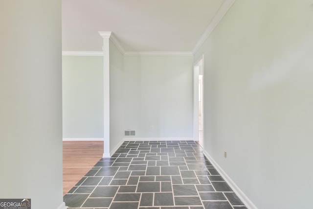 spare room featuring crown molding and dark hardwood / wood-style floors