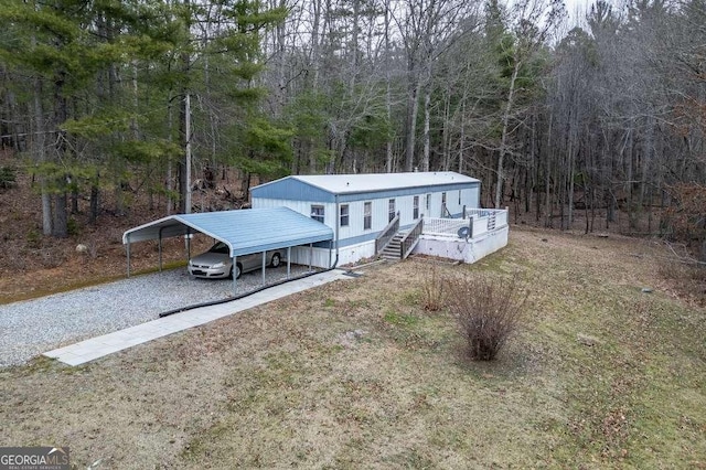 view of front of home with a carport