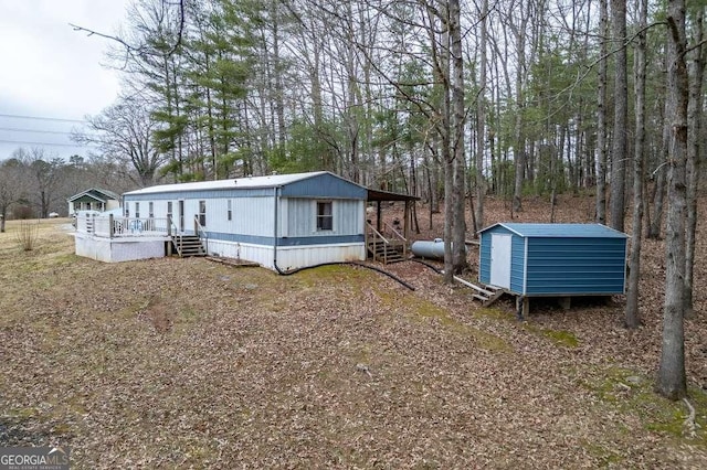 rear view of property featuring a deck