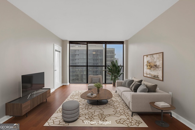 living room featuring floor to ceiling windows and dark hardwood / wood-style flooring