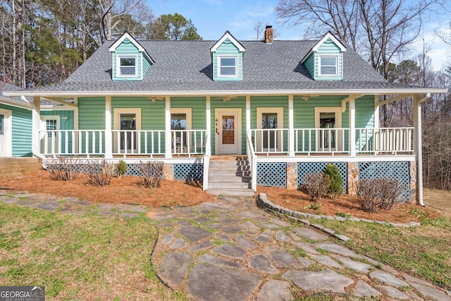 view of front of house with covered porch and roof with shingles