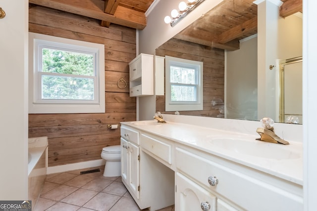 full bath with beamed ceiling, wood walls, a sink, and a healthy amount of sunlight