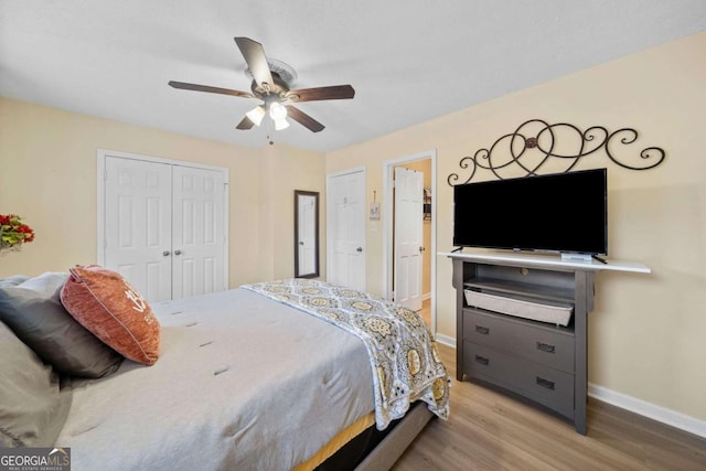 bedroom featuring a closet, ceiling fan, and light hardwood / wood-style flooring