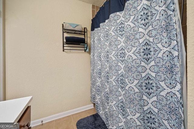 bathroom featuring a shower with curtain, vanity, and tile patterned flooring