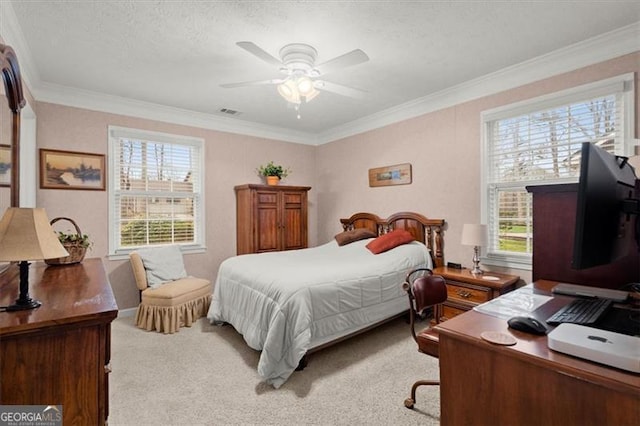 carpeted bedroom with crown molding, ceiling fan, and a textured ceiling