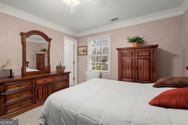 carpeted bedroom featuring crown molding and ceiling fan