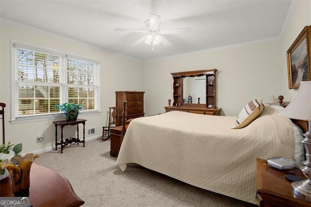 bedroom with crown molding, carpet, and ceiling fan