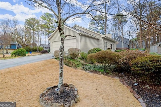 view of side of property featuring a garage