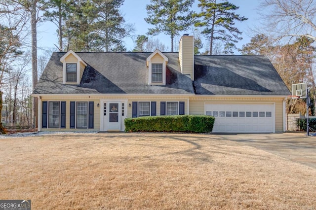 cape cod house featuring a garage and a front yard