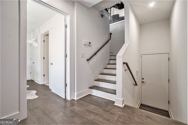 stairway featuring hardwood / wood-style floors