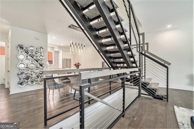 stairway with wood-type flooring