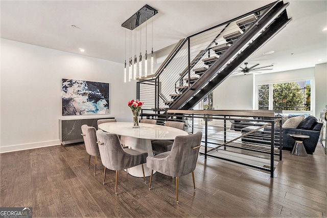 dining area featuring dark wood-type flooring and ceiling fan