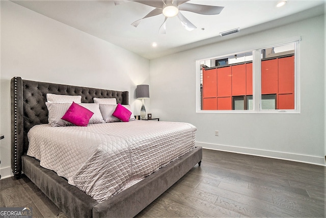 bedroom with dark wood-type flooring and ceiling fan