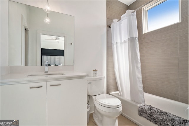 full bathroom with vanity, shower / tub combo with curtain, ceiling fan, and toilet