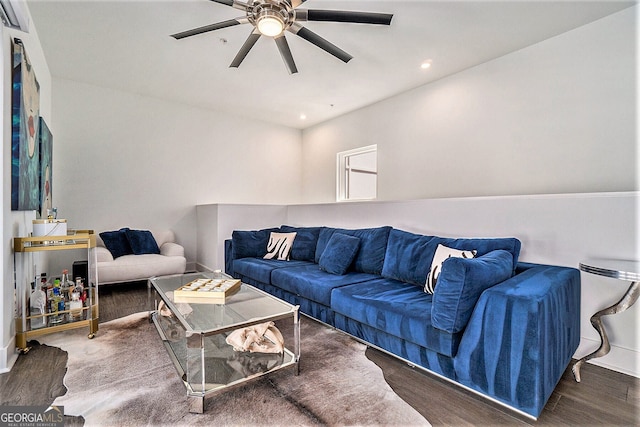 living room featuring dark hardwood / wood-style floors and ceiling fan