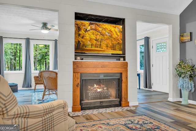 living room featuring crown molding and hardwood / wood-style floors