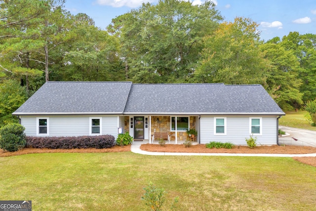 ranch-style home with a porch and a front yard