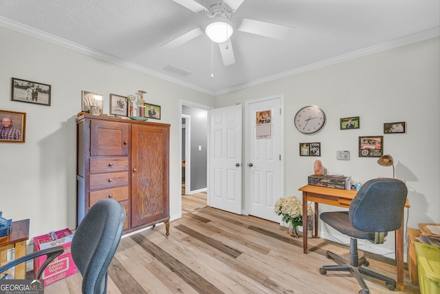 office featuring crown molding, light hardwood / wood-style floors, and ceiling fan