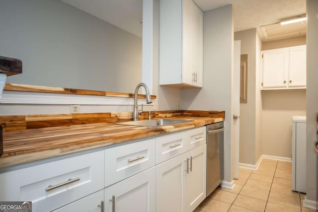 100 Downing Way Unit E, Athens, GA 30606 - kitchen with wood counters, white cabinetry, sink, stainless steel dishwasher, and light tile patterned floors