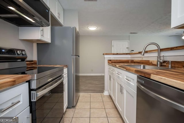 100 Downing Way Unit E, Athens, GA 30606 - kitchen with white cabinetry, stainless steel appliances, and wooden counters