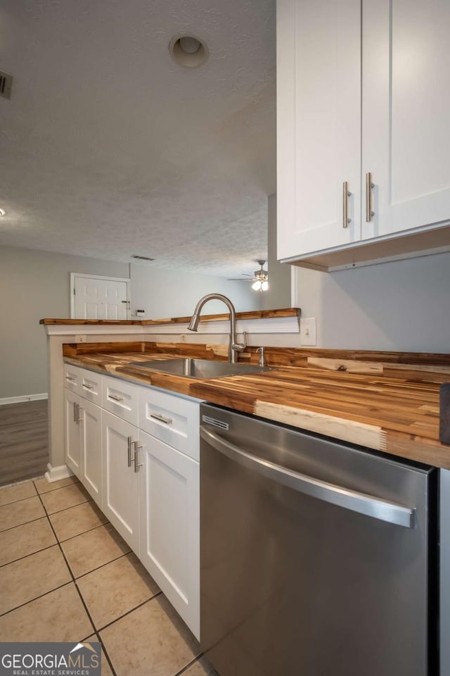 100 Downing Way Unit E, Athens, GA 30606 - kitchen with white cabinetry, sink, wooden counters, and dishwasher