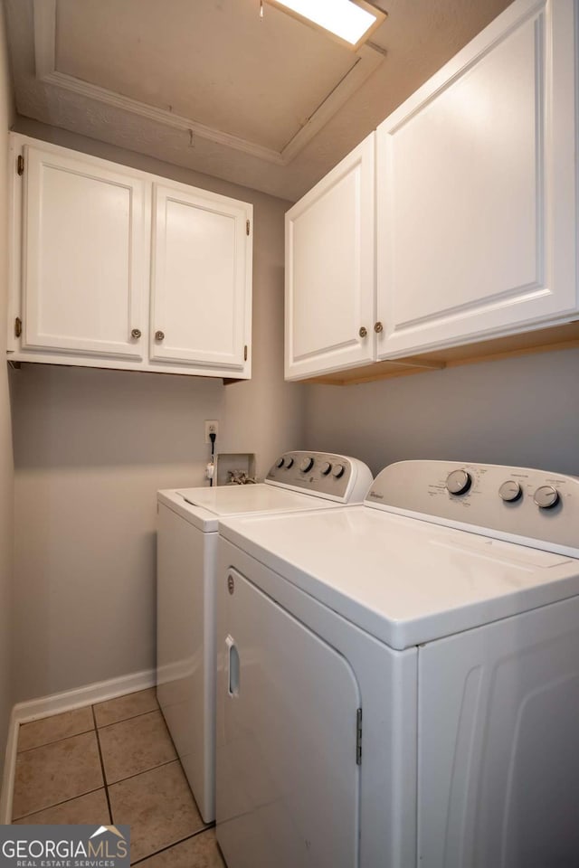 100 Downing Way Unit E, Athens, GA 30606 - clothes washing area with separate washer and dryer, light tile patterned floors, and cabinets
