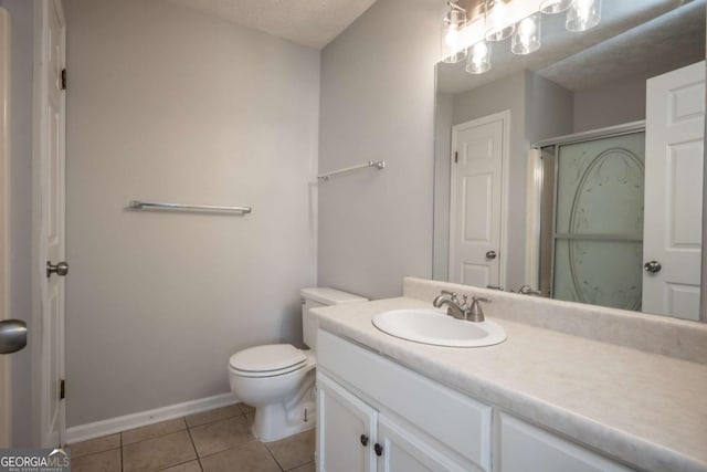 100 Downing Way Unit E, Athens, GA 30606 - bathroom with vanity, an enclosed shower, toilet, tile patterned floors, and a textured ceiling