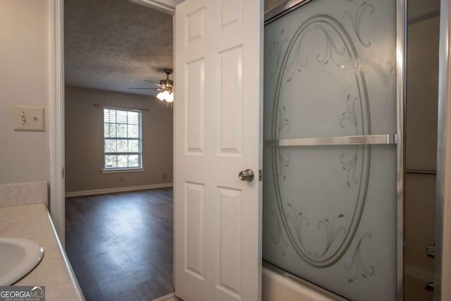 100 Downing Way Unit E, Athens, GA 30606 - interior space with combined bath / shower with glass door, a textured ceiling, vanity, hardwood / wood-style flooring, and ceiling fan