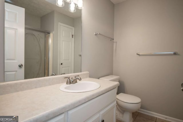 100 Downing Way Unit E, Athens, GA 30606 - bathroom featuring vanity, tile patterned floors, toilet, and walk in shower