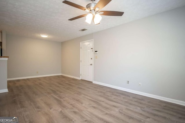 100 Downing Way Unit E, Athens, GA 30606 - empty room with hardwood / wood-style flooring, ceiling fan, and a textured ceiling
