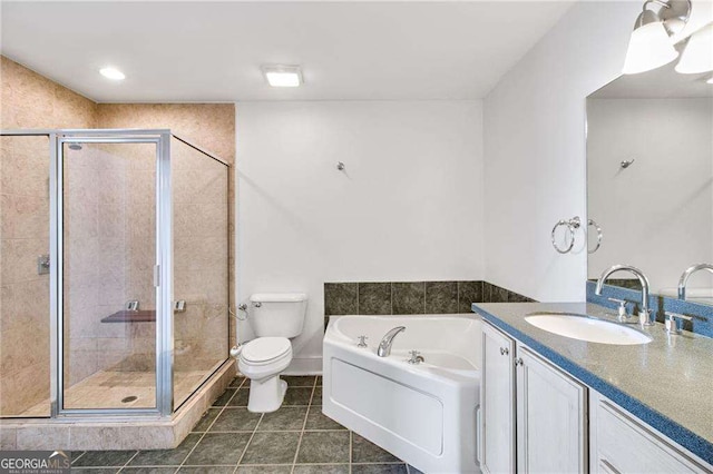 full bathroom featuring vanity, tile patterned floors, shower with separate bathtub, and toilet