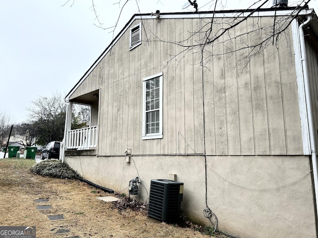 view of side of home featuring central AC unit