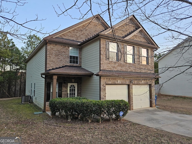 view of front property with a garage and central air condition unit