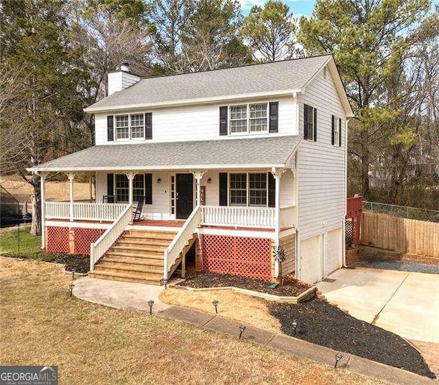 view of front of home featuring a garage and covered porch