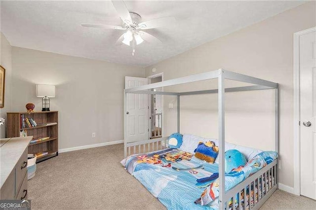 carpeted bedroom featuring ceiling fan