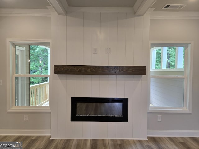 508 Clayborne Way Unit 246A, Loganville, GA 30052 - detailed view of ornamental molding, a glass covered fireplace, wood finished floors, and baseboards