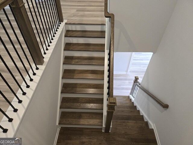 508 Clayborne Way Unit 246A, Loganville, GA 30052 - stairs with wood finished floors and baseboards