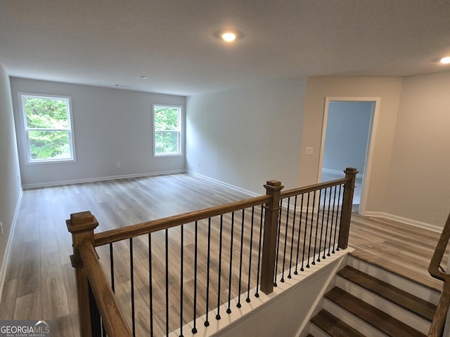 508 Clayborne Way Unit 246A, Loganville, GA 30052 - stairway featuring wood finished floors, recessed lighting, plenty of natural light, and baseboards