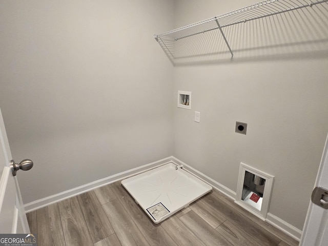 508 Clayborne Way Unit 246A, Loganville, GA 30052 - washroom featuring hookup for a washing machine, baseboards, wood finished floors, and hookup for an electric dryer
