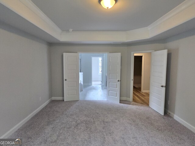 508 Clayborne Way Unit 246A, Loganville, GA 30052 - unfurnished bedroom with carpet floors, a tray ceiling, and baseboards