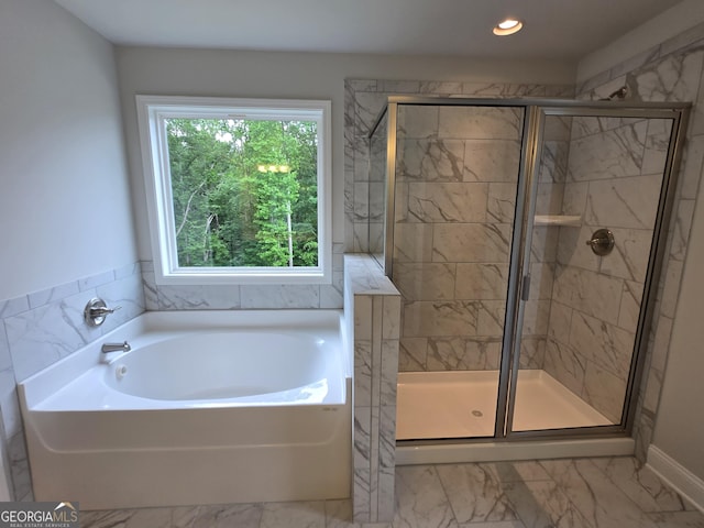 508 Clayborne Way Unit 246A, Loganville, GA 30052 - full bathroom featuring a garden tub, a stall shower, marble look tile flooring, and recessed lighting