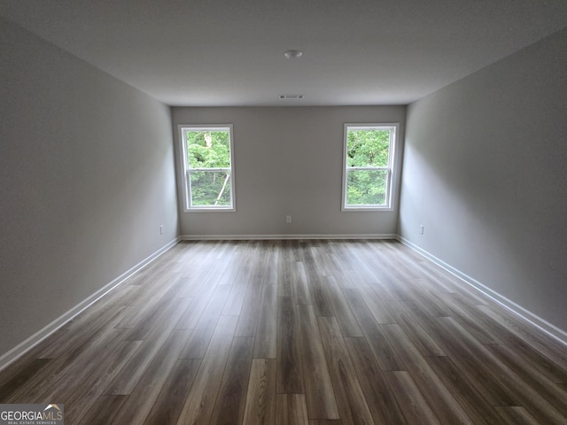 508 Clayborne Way Unit 246A, Loganville, GA 30052 - empty room with dark wood-style floors and baseboards