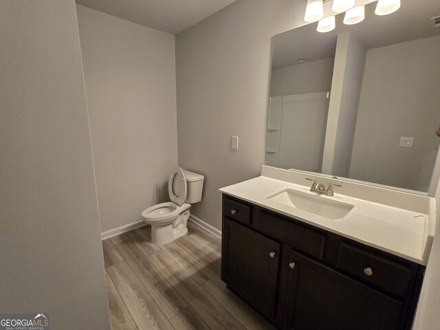 508 Clayborne Way Unit 246A, Loganville, GA 30052 - full bath with toilet, wood finished floors, vanity, and baseboards