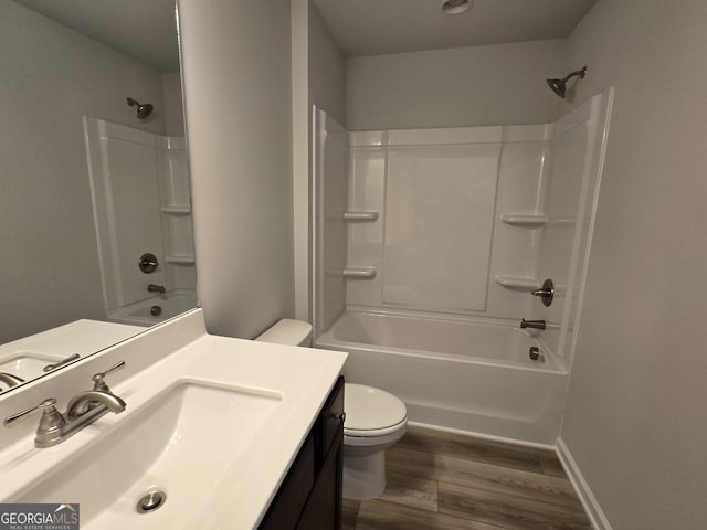 508 Clayborne Way Unit 246A, Loganville, GA 30052 - bathroom featuring toilet, vanity, wood finished floors, shower / bath combination, and baseboards