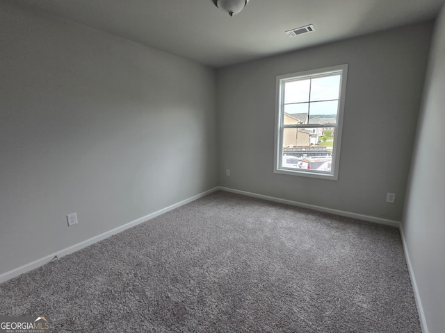 508 Clayborne Way Unit 246A, Loganville, GA 30052 - carpeted spare room featuring baseboards