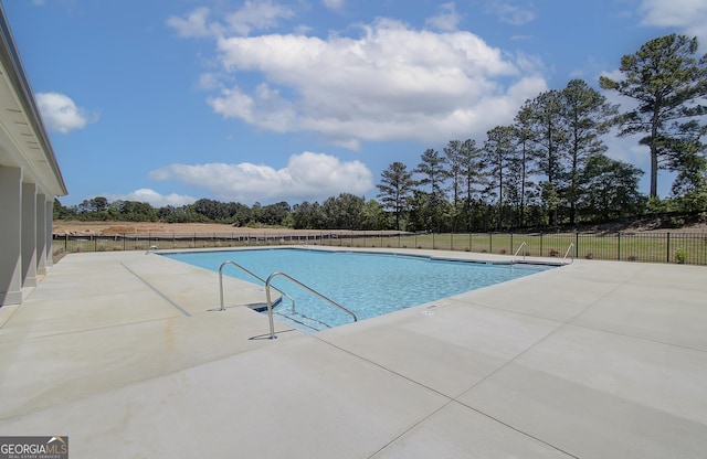 508 Clayborne Way Unit 246A, Loganville, GA 30052 - community pool with a patio area and view of wooded area