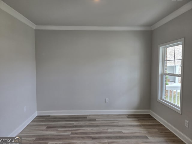 508 Clayborne Way Unit 246A, Loganville, GA 30052 - spare room featuring ornamental molding, wood finished floors, and baseboards