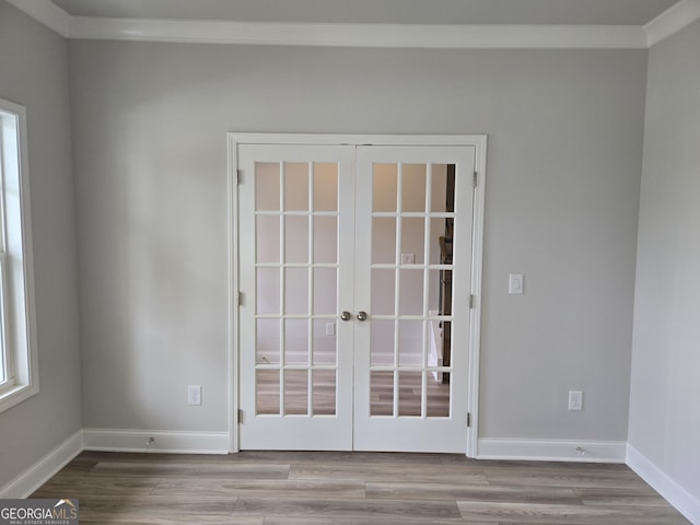 508 Clayborne Way Unit 246A, Loganville, GA 30052 - empty room with ornamental molding, french doors, wood finished floors, and baseboards